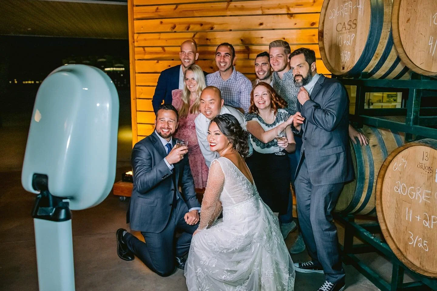 Friends laughing together with confetti at the photo booth